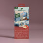 A box of Enviroscent Honeycrisp Apple & Cardamom air freshener refills, featuring a winter cabin scene with snow, trees, apples, and a reed diffuser on the front. The box highlights it is non-toxic and lasts over 30 days.