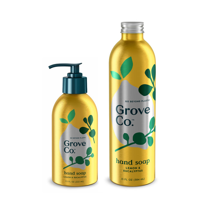 The Refillable Hand Soap Starter Set by Grove Co. includes two yellow bottles featuring natural Lemon & Eucalyptus scents. The smaller has a pump, and the larger a cap, both with green leaf graphics and highlighting plant-based ingredients in recyclable packaging.