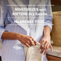 A person wearing a striped shirt and rings holds a cloth next to a bottle of Mrs. Meyer’s Hand Lotion, with text reading MOISTURIZES and SOFTENS dry hands. NO GREASY FEEL. overlaid on this cruelty-free product.