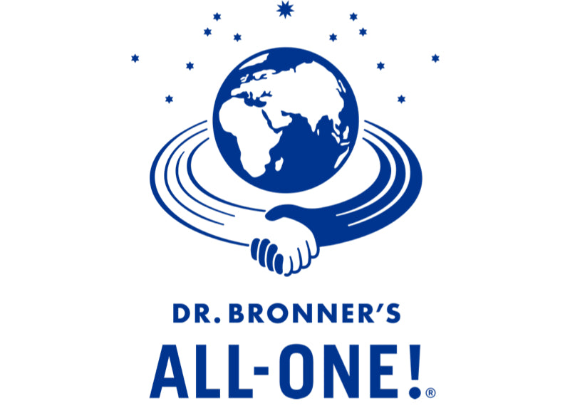 A blue illustration of Earth with stars around it, and two hands clasped in a handshake forming part of the planets orbit. Below, the text reads Dr. Bronner’s All-One! in bold blue letters.