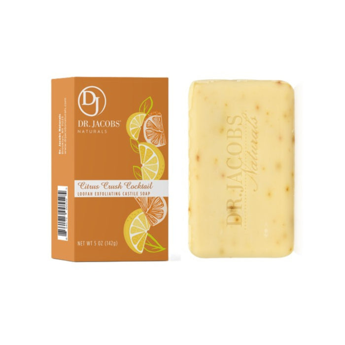 A bar of Dr. Jacobs Naturals Citrus Crush Cocktail Loofah Exfoliating Castile Soap is shown next to its orange box, which features illustrations of sliced citrus fruits. The soap bar is a light yellow color with visible exfoliating particles.