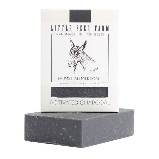 Little Seed Farm’s Activated Charcoal Facial & Body Bar, handmade in Tennessee with organic oils, is perfect for acne-prone skin and detoxifying care. Features goat-themed packaging and a sleek dark gray finish.