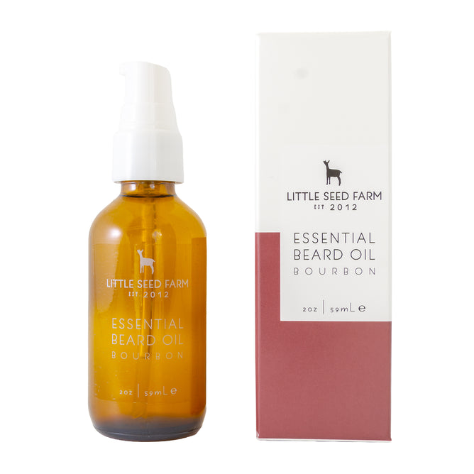 A brown glass bottle of Little Seed Farm Beard Oil with a white pump, beside its white and maroon box showing the product name and 2oz (59mL) size—a perfect beard moisturizer and softener.
