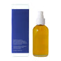 A clear pump bottle of Little Seed Farm Body Oils, containing yellow oil, stands beside a tall blue and white box listing ingredients and product details, emphasizing its moisturizing benefits.