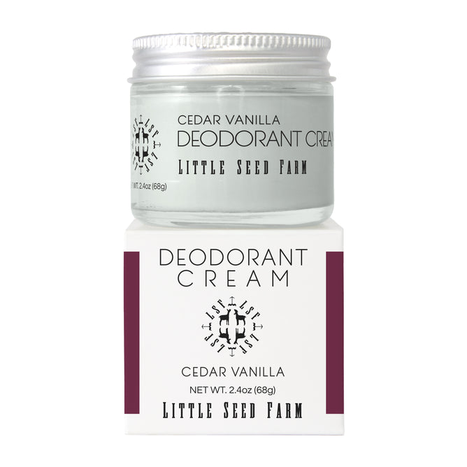 Little Seed Farm Deodorant Creams are displayed in a white jar with a silver lid, featuring minimalist black text on white packaging with maroon accents. This natural, aluminum-free deodorant cream sits atop its branded box.