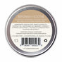 A round metal tin of Little Seed Farm Lip Salve features a label listing healing botanicals, and highlighting its GMO-free, gluten-free, paraben-free, and cruelty-free qualities.