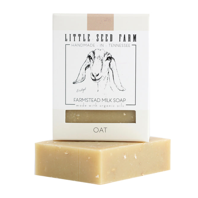Little Seed Farm’s Oat Cleansing Body & Facial Bar - Exfoliating features skin-calming oat, comes in minimalist packaging with a goat illustration, and is handmade in Tennessee using organic oils.