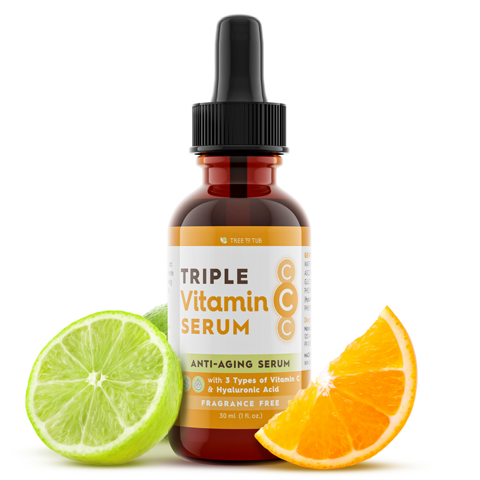 A brown dropper bottle labeled Triple Vitamin C Serum with lime and orange slices beside it, emphasizing vitamin C ingredients. The label mentions anti-aging, hyaluronic acid, and fragrance-free.