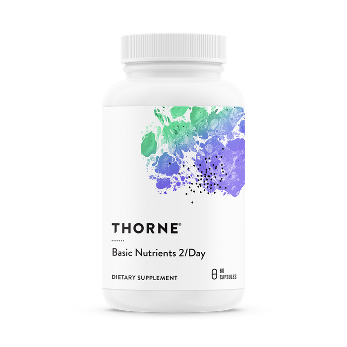 A white bottle of Thorne Basic Nutrients 2/Day dietary supplement with a colorful abstract design on the label, containing 60 capsules.