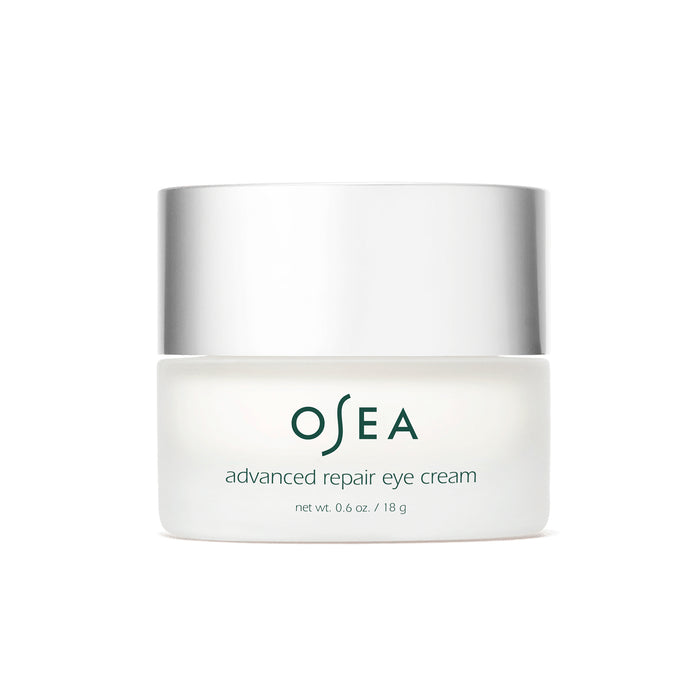A white jar with a silver lid labeled OSEA advanced repair eye cream, containing 0.6 oz (18 g) of product, is shown on a plain white background.