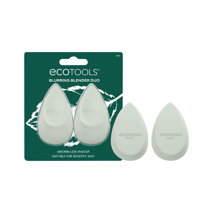 Two light green Ecotools makeup blenders are shown in packaging labeled “Blurring Blender Duo,” with two more blenders displayed outside the package. The packaging states, “Absorbs less makeup. Suitable for sensitive skin.”.