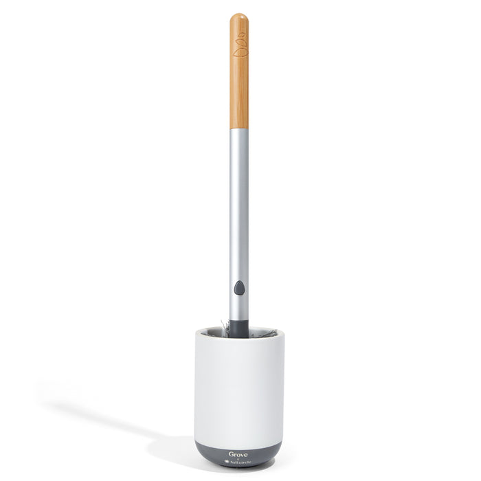 A modern toilet brush with a light wooden handle, a silver shaft, and a gray and white cylindrical holder on a white background.