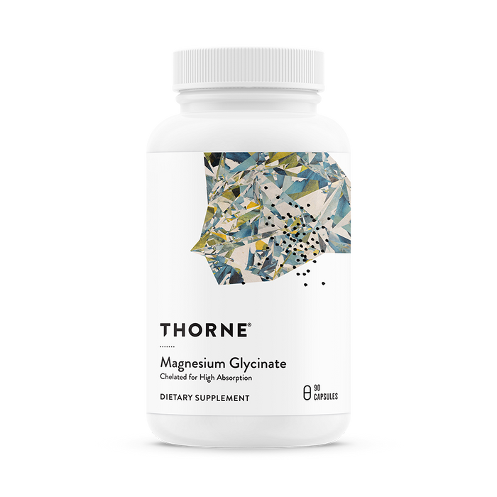 A white bottle of Thorne Magnesium Glycinate shows an abstract geometric label design. The bottle contains 90 capsules of chelated magnesium for high absorption.