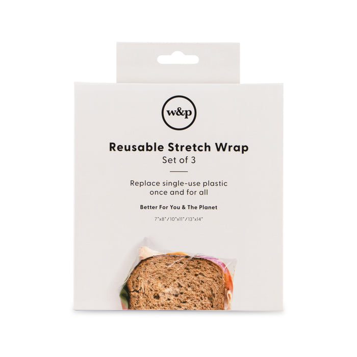 A white package labeled w&p Reusable Stretch Wrap Set of 3 with a photo of a wrapped sandwich at the bottom. Text highlights replacing single-use plastic and benefits for the user and the planet.