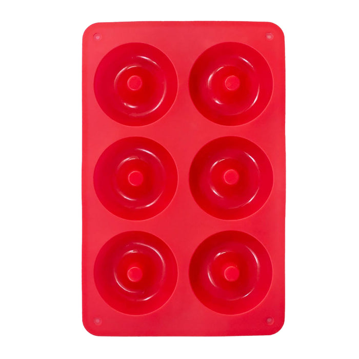 A red silicone baking mold with six round cavities, each shaped like a donut, arranged in two columns of three.