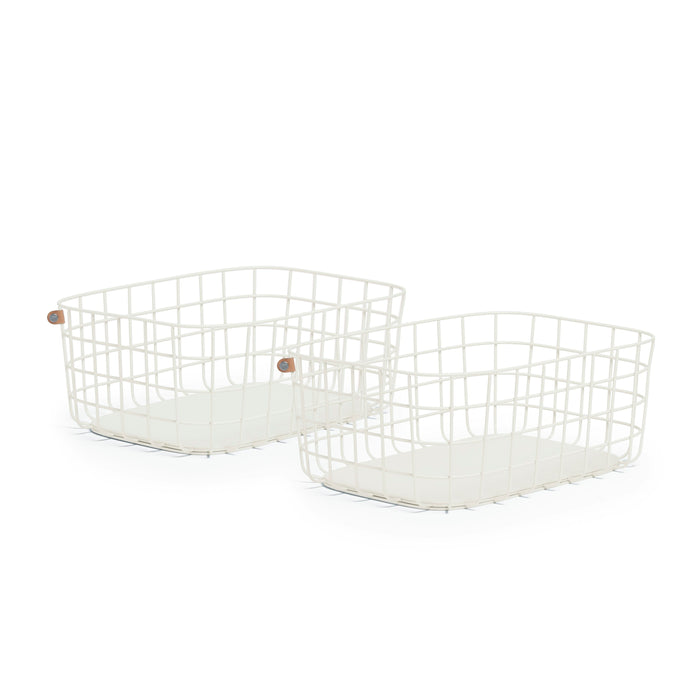 Two white metal wire storage baskets with rectangular shapes and open tops, placed on a white background. Each basket has a leather accent on one corner.