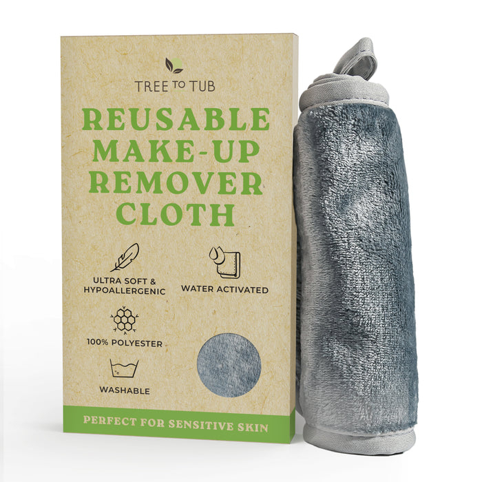 A box labeled Tree to Tub Reusable Make-Up Remover Cloth stands next to a rolled-up gray cloth. The packaging highlights features: ultra soft, hypoallergenic, water activated, 100% polyester, and washable.