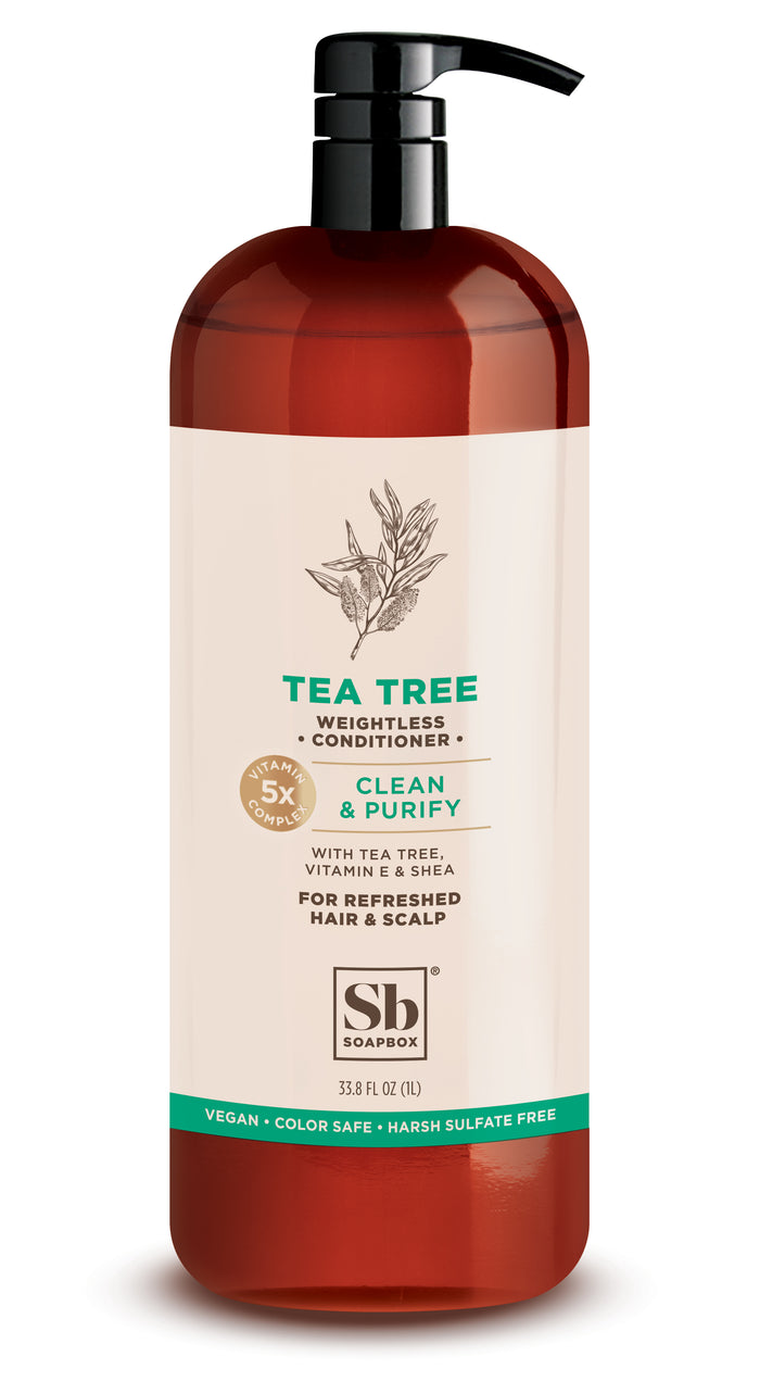 A brown bottle with a black pump labeled TEA TREE Weightless Conditioner by Soapbox. The label highlights tea tree, vitamin E, and shea, and notes it is vegan, color safe, and free of harsh sulfates.