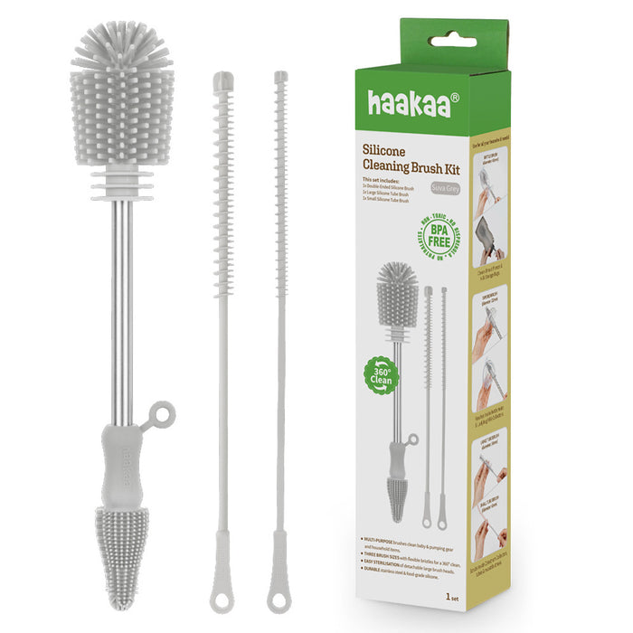 Haakaa Silicone Cleaning Brush Kit with three brushes of different sizes and a green and white box showing product information, features, and usage illustrations.