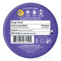 A round purple tin of Badger Balm Adventure Mineral Sunscreen Tin - SPF 50. The label indicates it is 98% organic and unscented with clear zinc oxide. It lists drug facts, the active ingredient, usage instructions as a sunscreen, warnings, and certifications such as cruelty-free and NSF. This reef-friendly formula is gentle on skin and safe for the environment.