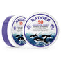 Two round tins of Badger Balm Adventure Mineral Sunscreen Tin - SPF 50, featuring orca illustrations on the label. This zinc oxide-based mineral sunscreen comes in packaging that emphasizes its water resistance, reef-friendly formula, and suitability for adventure sports.