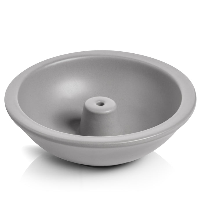 A round, gray ceramic bowl with a raised center, resembling a bundt pan or a dish for holding items like rings or eggs. The surface is smooth and glossy.