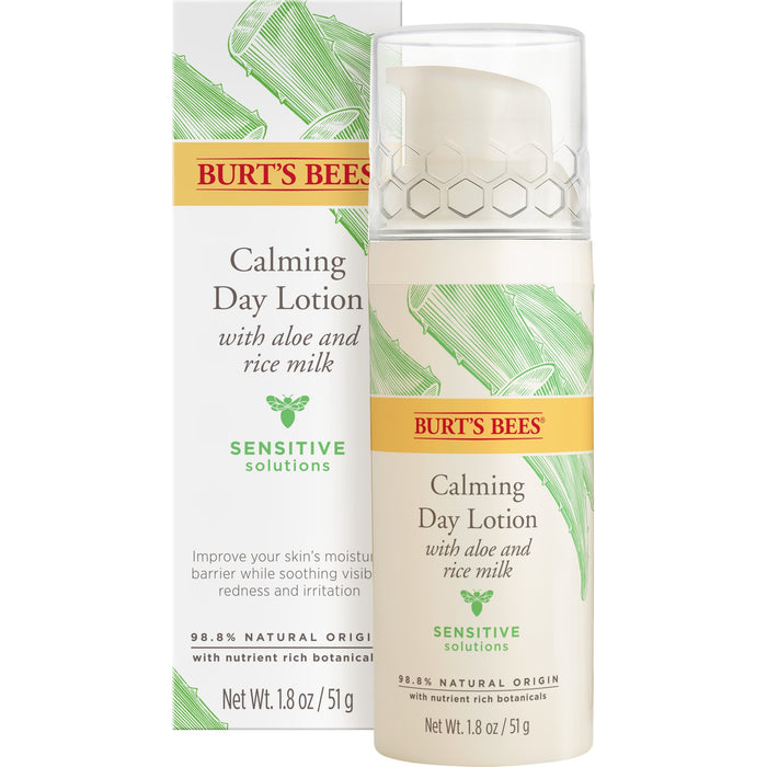 A bottle of Burt’s Bees Calming Day Lotion with aloe and rice milk is shown in front of its box. Both are labeled “Sensitive Solutions” and highlight that the product is for sensitive skin and contains 98.8% natural origin ingredients.