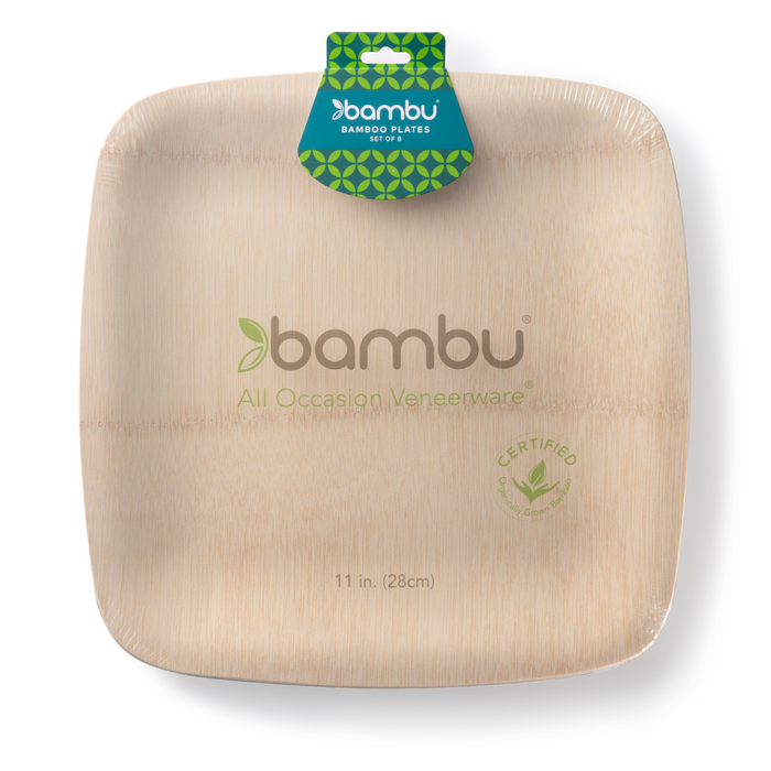 A square, light-colored bamboo plate in clear packaging, labeled bambu All Occasion Veneerware with a green leaf logo. A blue and green tag at the top reads bambu bamboo plates. Plate size: 11 in. (28 cm).