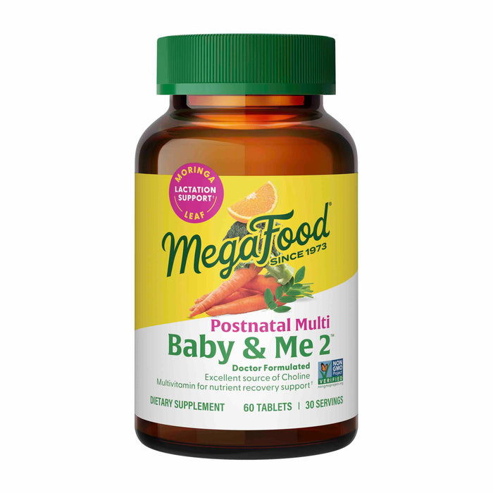 A bottle of MegaFood Postnatal Multi Baby & Me 2 dietary supplement with a green cap and label featuring carrots, leafy greens, and the text Moringa Leaf Lactation Support. The bottle contains 60 tablets for 30 servings.