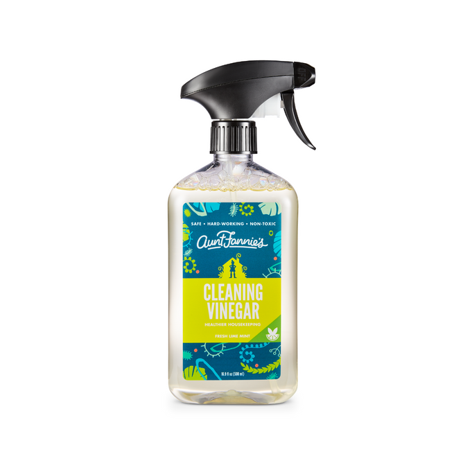 Aunt Fannies All-Purpose Cleaner comes in a clear plastic spray bottle with a blue floral label, is safe, non-toxic, highly effective, and infused with essential oils for a refreshing lime mint scent.