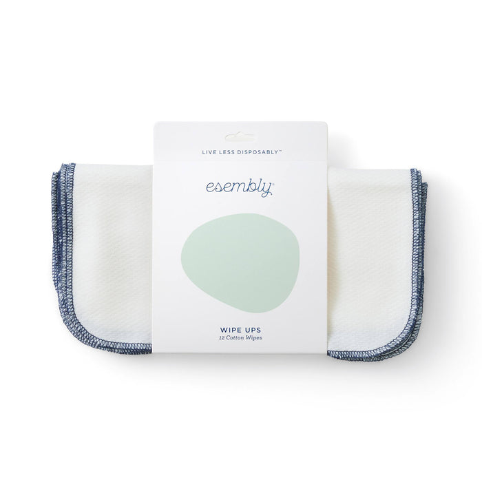 A pack of Esembly Wipe Ups, featuring 12 white cotton wipes with blue edges, is shown in simple, eco-friendly packaging labeled Live Less Disposably.
