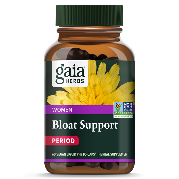 A bottle of Gaia Herbs Bloat Support for Women, labeled as a herbal supplement for period support with 60 vegan liquid phyto-caps. The label features a yellow flower and Non-GMO Project Verified seal.