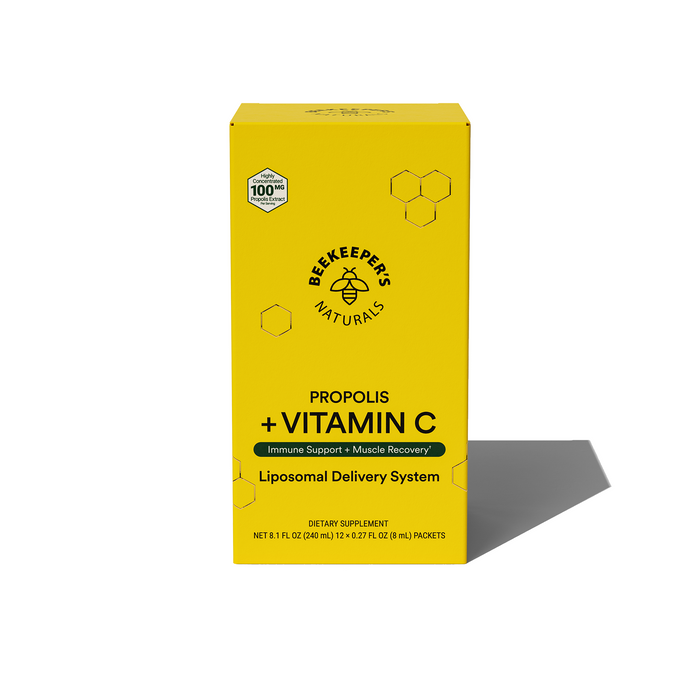 A yellow box of Beekeepers Naturals Propolis + Vitamin C dietary supplement with a liposomal delivery system, featuring black text and hexagon designs on the front.