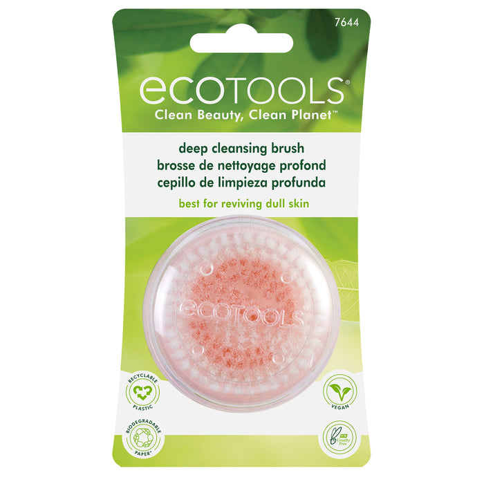 A packaged EcoTools deep cleansing brush with soft pink bristles. The packaging is green and white, highlighting eco-friendly features, including vegan, recycled materials, and suitable for reviving dull skin.