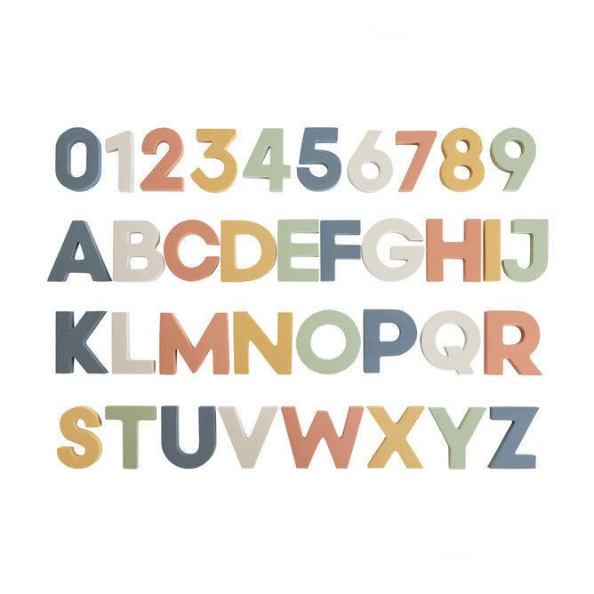 The mushie Foam Letters & Numbers Bath Play Set features water-safe, educational foam pieces in pastel colors, ideal for early learners to explore numbers 0-9 and capital letters A-Z during bath time.