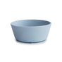 The mushie Silicone Suction Bowl is a plain, light blue, round bowl made from BPA-free, food-grade silicone with smooth sides and a slightly flared rim—safe, non-toxic, and perfect for baby essentials.