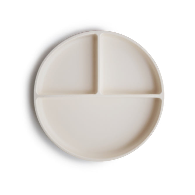 The mushie Silicone Suction Plate is a BPA-free, food-grade cream plate with three compartments—two small and one large—perfect for your baby’s essentials.
