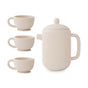 The mushie Silicone Tea Play Set – Pretend Play, BPA-Free, features a modern, minimalist design with a cream-colored teapot and three matching cups—ideal for pretend play as a safe, stylish alternative to ceramic sets.