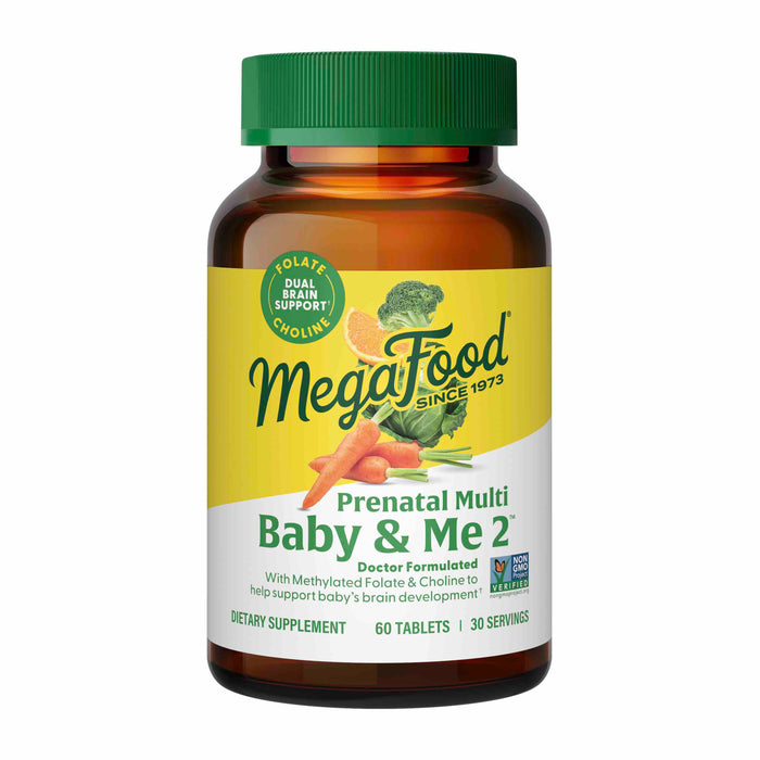 A bottle of MegaFood Prenatal Multi Baby & Me 2 dietary supplement with 60 tablets. The label highlights folate and choline support, features images of fruits and vegetables, and notes its doctor formulated and non-GMO.