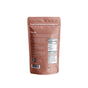 Back view of a pink stand-up pouch from blume displaying the product name Vanilla Chai Blend. The package reads Superfood blends to indulge in, with aromatic spices and creamy vanilla. Also visible are preparation instructions, a QR code, social media icons, and a nutrition facts label.