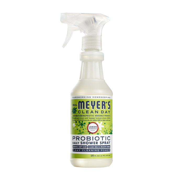 A spray bottle of Mrs. Meyer’s Clean Day Probiotic Daily Shower Spray in Lemon Verbena scent, 16 fl oz, with a green and white label and a clear trigger nozzle.