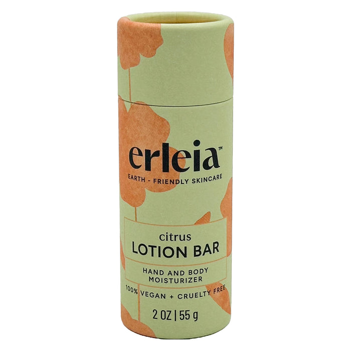 A cylindrical container of Erleia Citrus Lotion Bar, labeled as earth-friendly skincare. The packaging is green with orange accents and states it is 100% vegan, cruelty-free, and contains 2 oz (55 g).