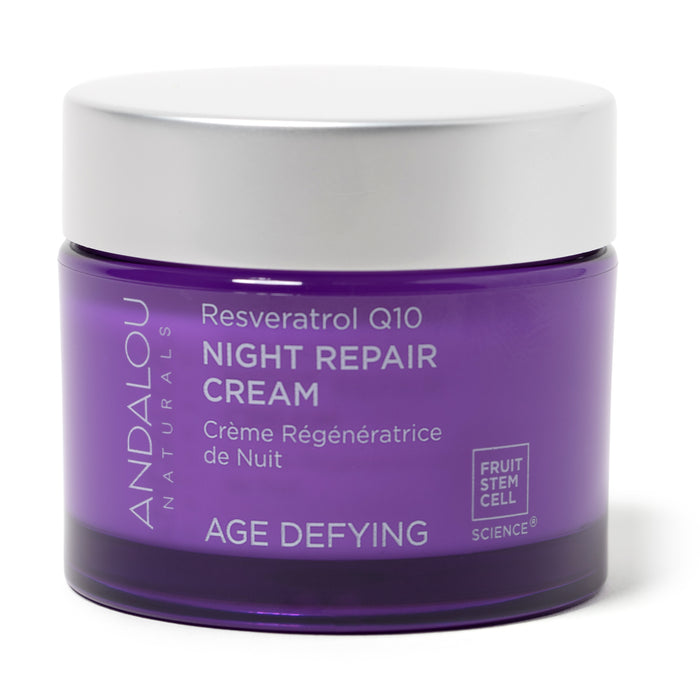 A purple jar of Andalou Naturals Resveratrol Q10 Night Repair Cream with a white lid, labeled as Age Defying and Fruit Stem Cell Science. The text is in English and French.