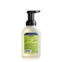 A bottle of Mrs. Meyer’s Clean Day foaming hand soap with a black pump dispenser, showing the back label with product details and ingredients on a light green background.