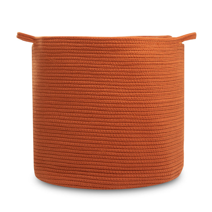 A large, round, orange woven storage basket with two small handles near the rim, photographed against a white background.