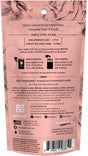 Back of a pink laundry detergent packet with floral designs, displaying usage instructions, product information, ingredient list, and various certification logos such as cruelty-free and USA-made. Barcode is shown at the bottom right.