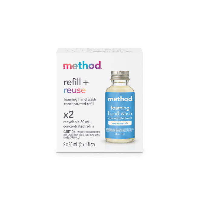 A box of Method foaming hand wash concentrated refill in sea minerals scent, featuring a clear bottle with blue label on the front. The box emphasizes refill + reuse and contains 2 recyclable 30 mL refills.