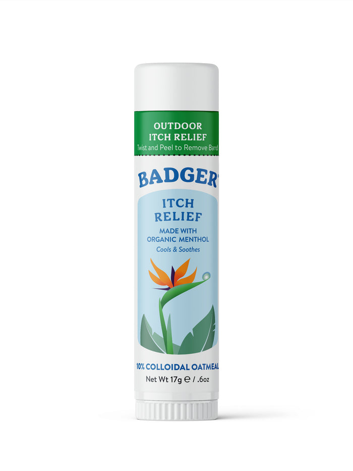 A white tube of Badger Itch Relief, labeled Outdoor Itch Relief and Made with organic menthol. The tube shows a flower illustration and indicates 10% colloidal oatmeal, net weight 17g (0.6oz).