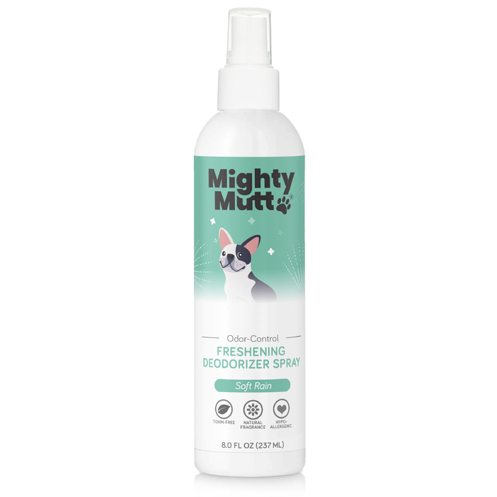 A white spray bottle labeled “Mighty Mutt Odor-Control Freshening Deodorizer Spray, Soft Rain.” The label features an illustration of a dog and icons indicating it is toxin-free, paraben-free, and fragrance allergen-free.