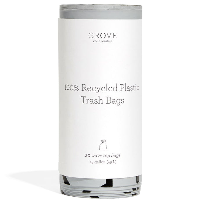 A roll of Grove Collaborative 100% recycled plastic trash bags with a white label, featuring product details and simple text design; contains 20 wave top bags, 13-gallon (49 L) capacity.